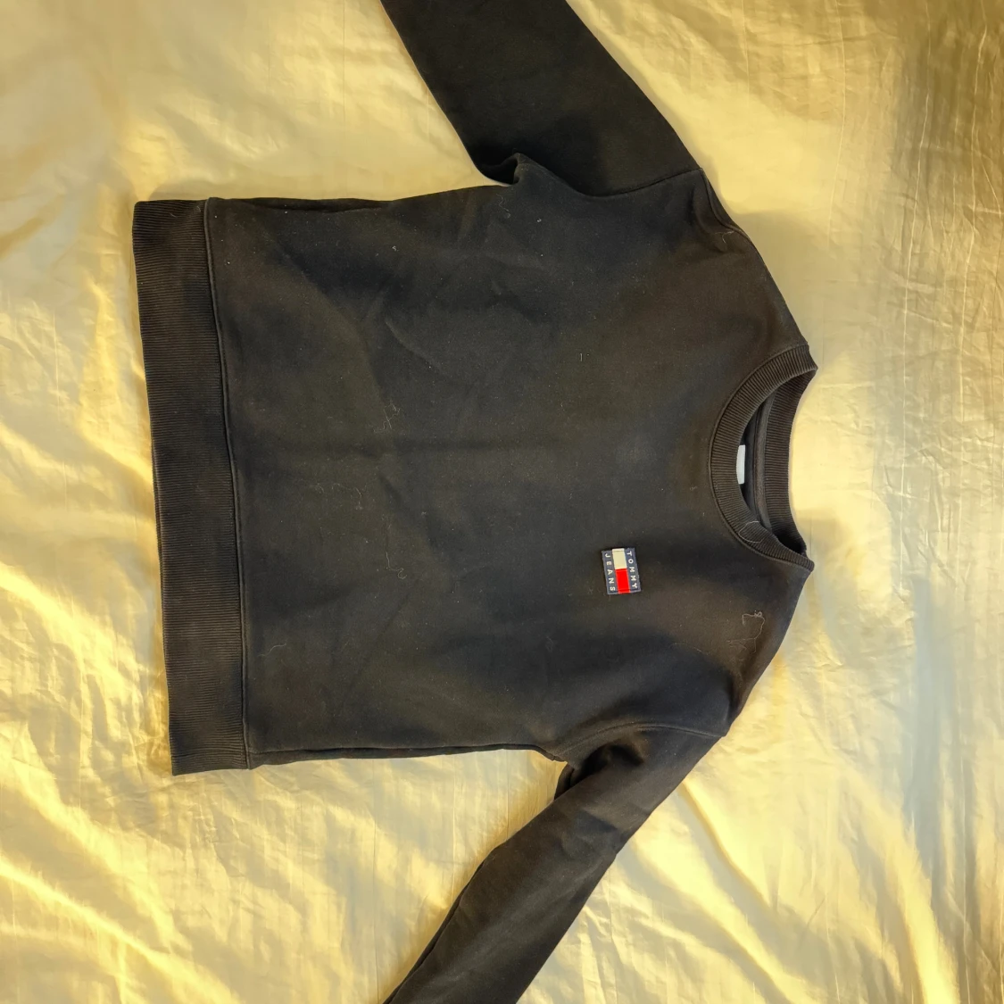 Svart sweatshirt från Tommy Jeans