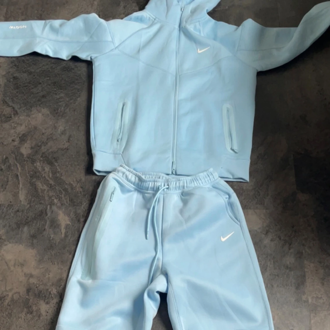 Ljusblå Nike NOCTA hoodie med dragkedja