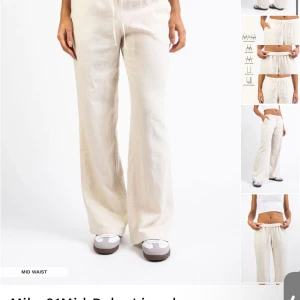 Beiga linnebyxor från Madlady L-Tall - Snygga beiga linnebyxor från Madlady i storlek L-Tall. Byxorna har midwaist, raka ben och dragsko i midjan för skön passform. Perfekta för en chill och avslappnad look under varmare dagar.