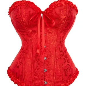 Röd korsett med snörning och volang - Säljer en röd korsett med vackert broderat mönster. Toppen har snörning både fram och bak, volangkant upptill och nedtill samt metallknäppning framtill. Endast använd 1 gång