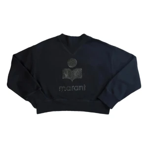 Svart sweatshirt från isabel marant  - Cool svart sweatshirt från isabel marant med glittrig logga framtill. Tröjan har inga skador och är knappt använd 