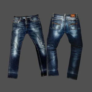 Nudie archive denim jeans - faded jeans med slitage - Otroligt feta och annorlunda jeans med rikigt mycket fade och en del slitage som får ens outfit att skina. Jeansen är i storlek 31/34 men passar även 31/32. Jeansen är perfekta nu till våren och får ens outfit att sticka ut rejält! Bara att skriva vid yttligare frågor!