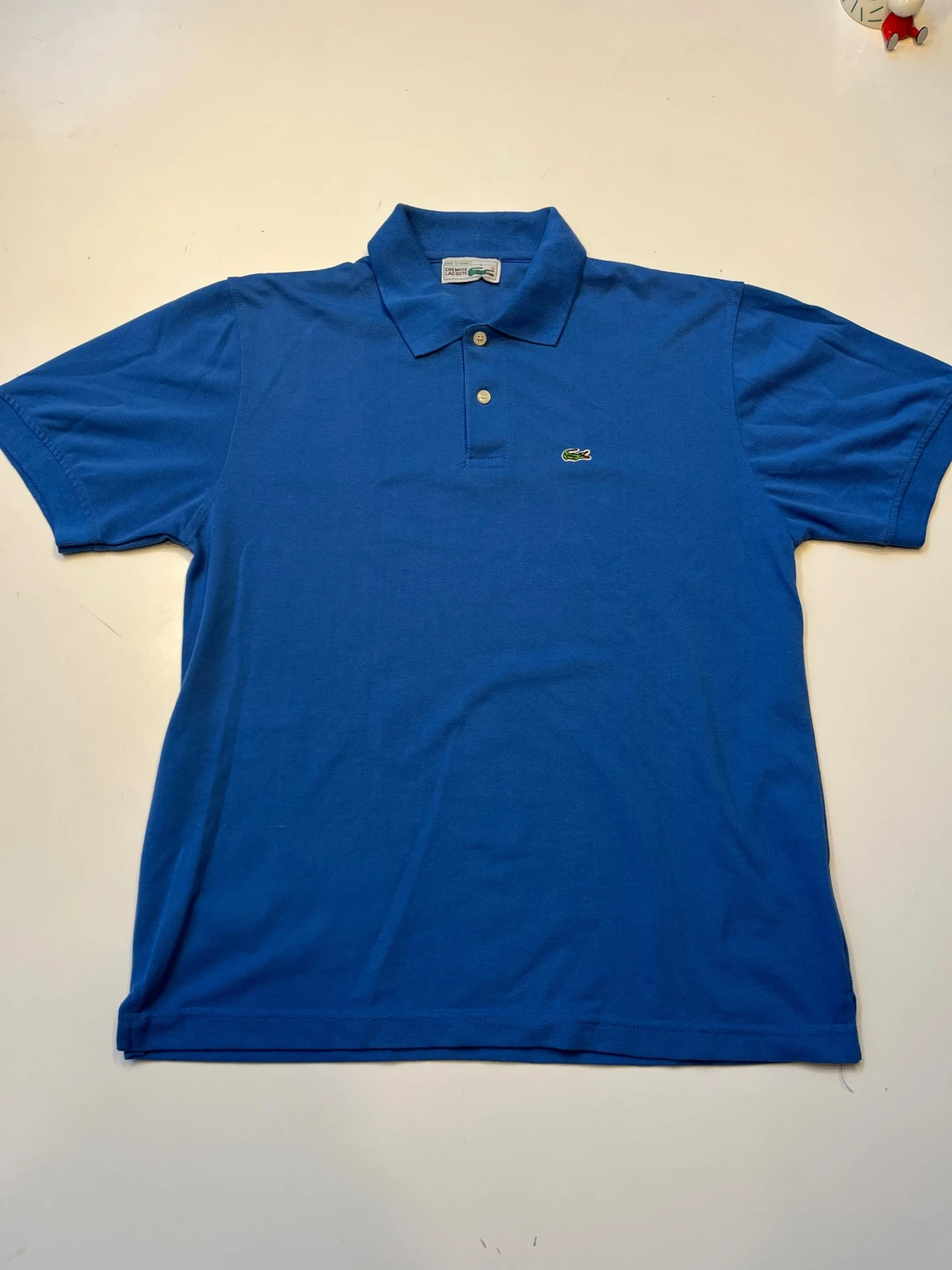 Blå polotopp från Lacoste