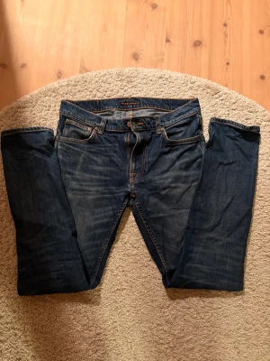 Nudie jeans grim tim - Ett par schyssta nudie jeans grim tim, inga fel överhuvudtaget, slutat använda dem. Riktigt sköna till vintern och hållbart material. Stl 30/32. Välkomnar prisförslag