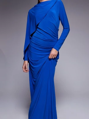 Blå långärmad långklänning - Säljer en elegant blå långklänning med långa ärmar och draperade detaljer. Klänningen har en asymmetrisk design och är tillverkad i ett mjukt, stretchigt material som ger en snygg siluett. Perfekt för dig som vill sticka ut med en färgstark look.