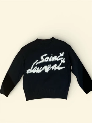  stickad Saint Laurent tröja - Svart stickad tröja från Saint Laurent. Ny i skick, aldrig använd. 