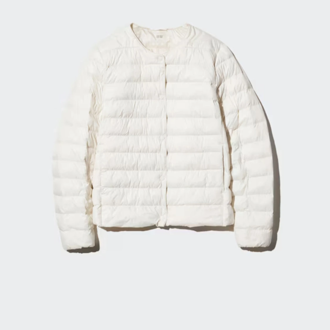 Pufferjacka från Uniqlo i marinblått och vitt - 1