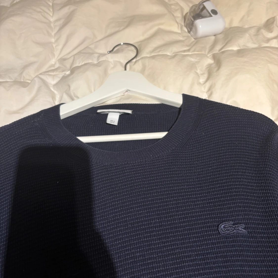 Mörkblå stickad tröja från Lacoste - 1