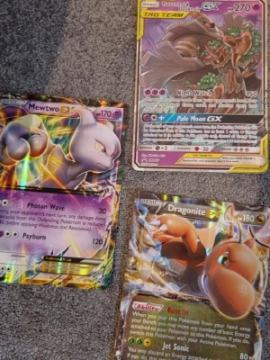 Pokemon kort - Tre Pokémonkort: Trevenant & Dusknoir GX Tag Team, Dragonite EX och Mewtwo EX.          Tag Team går för runt 200 Dragonite mewtwo ungefär 50 styck kan släppa alla för 200 om ni köper alla annars tag team 125kr dom andra två 40kr styck