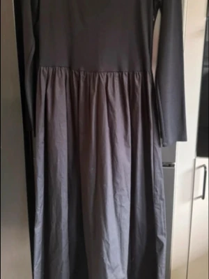 H&M Long Black Dress — Brand New - Elegant and feminine long black dress from H&M, brand new and never worn.  • Completely new with original tags attached • Stretchy, figure-hugging top for a flattering silhouette • Light, flowy skirt that moves beautifully • Soft cotton fabric for comfortable all-day wear • Timeless black colour — elegant and easy to style • Perfect for both everyday wear and special occasions  A beautiful combination of comfort and effortless elegance. The fitted top beautifully complements the light, flowing s