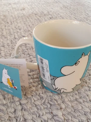 Muminmugg turkos Mumintroll Mumin  - Felfri mugg med etikett kvar. Säljer fler Muminmuggar så kika gärna på mina övriga annonser. Packar mycket bra. 