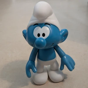 SMURF - Jätte söt smurf av plast som kan röra armarna. Passar som leksak eller som dekoration. Höjd ca 19,5 cm.