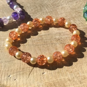 Armband  - Vackert armband av skimrande glaspärlor 🧡✨🌄