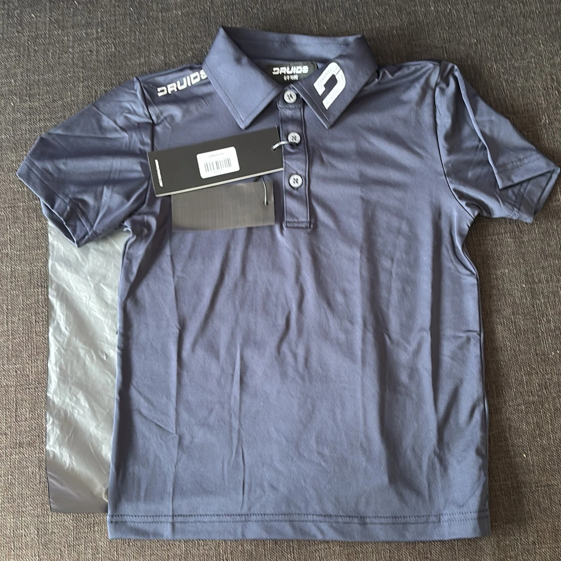 Mörkblå pikétröja från Druids 6/8 years