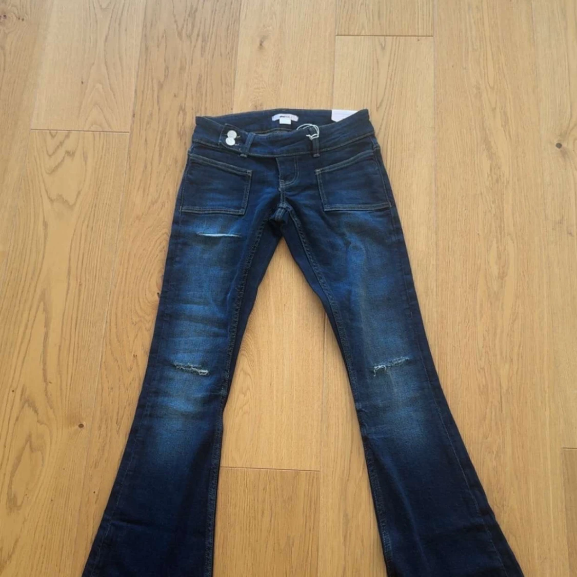 Blå bootcut jeans från Gina Tricot XXS