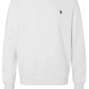 Vit sweatshirt från U.S. Polo Assn. - Säljer en stilren vit sweatshirt från U.S. Polo Assn. med liten broderad logga på bröstet. Tröjan har rund halsringning och långa ärmar med ribbade muddar. Perfekt för en clean och klassisk look.
