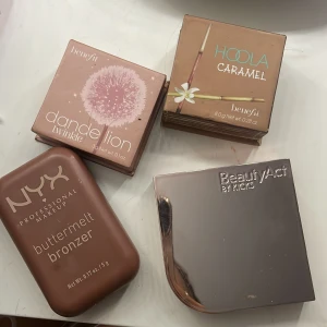 Mix av bronzers & rouge från Benefit, NYX & BeautyAct - Säljer fyra puderprodukter: Benefit Dandelion Twinkle (ljusrosa highlighter), Benefit Hoola Caramel (varm bronzer), NYX Buttermelt Bronzer (mjuk brun bronzer) och BeautyAct by Kicks rouge i en stark rosa nyans. de är knappt använda och ny pris på alla tillsammans är runt 1100kr och säljer alla för 200kr sammanlagt 
