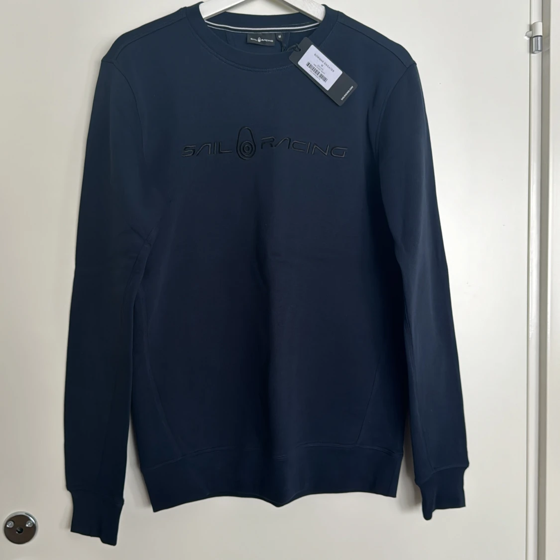 Mörkblå tröja från Sail Racing