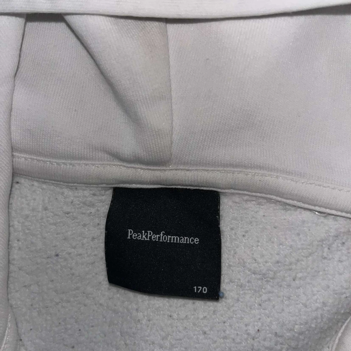 Vit hoodie från Peak Performance - 1