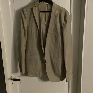 Beige kavaj  - Använd en gång 