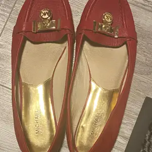 Michael kors flats, gently used, red color  
