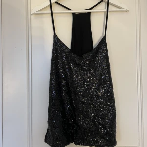 Glitter topp  - Ett glitter linne i storlek S