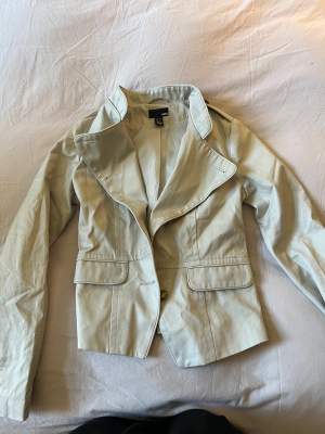 This jacket has been worn a few times, a button is missing