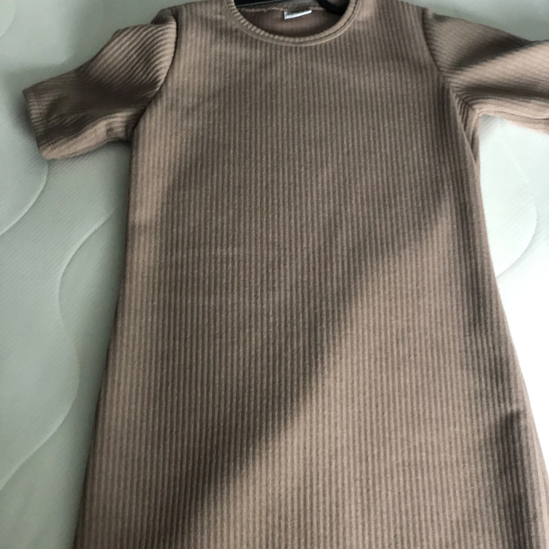 En kappa med en stickat tröja  - 90