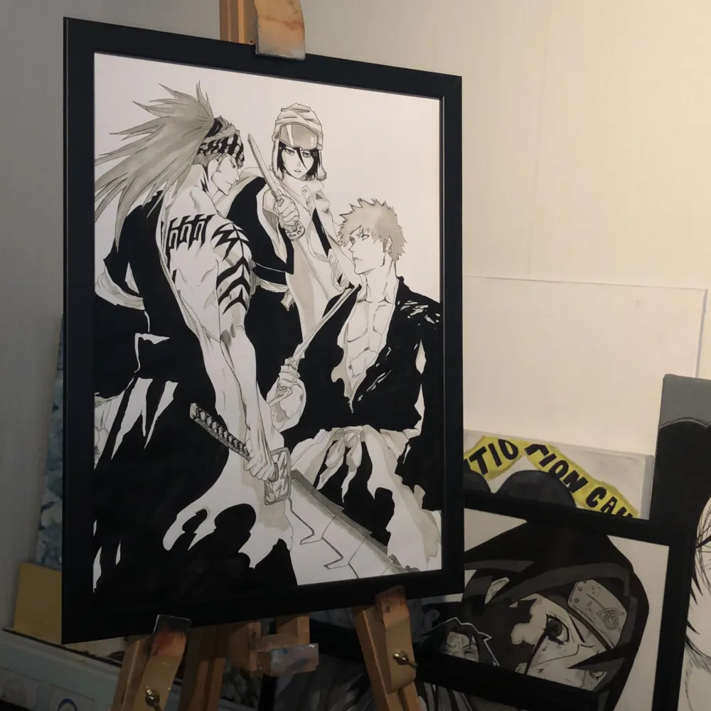 Drawing of the Bleach anime characters Renji, Rukia and Ichigo on thick paper with the size A3 paper put in black Ikea frame. Övrigt.