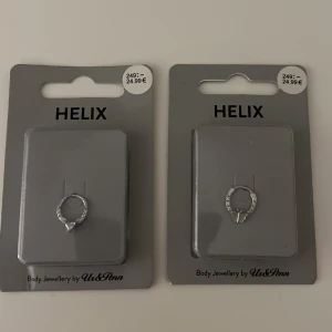 Helix piercing - Två oöppnad helix piercingar som är i färgen silver. Båda för 100kr och en för 50kr.