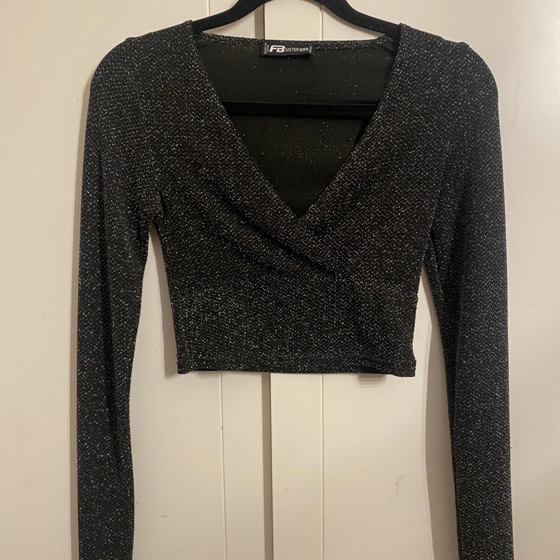 Glittrig urringad tröja