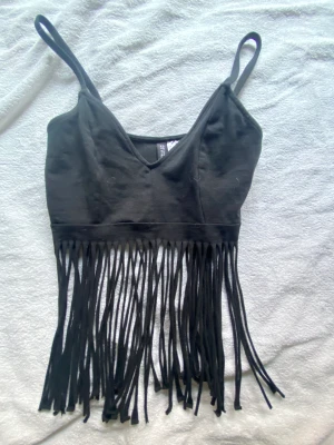 cowboy topp - En topp från h&m som är helt oanvänd men super häftig! Xs men passar på mig som bär M 