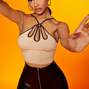 Beige/brun topp i strl. S - Beige/brun topp i strl. S, stretchigt material som även passar XS-M. Oanvänd.