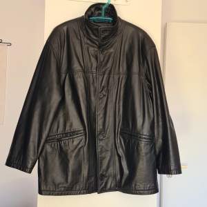 Used men's black faux leather jacket. Good condition except for tiny white paint spots on one sleeve - as seen on the last photo. 62cm armpit to armpit, 82cm length from shoulder to bottom.