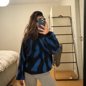 black and blue sweater
