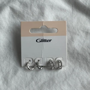 silver örhängen från glitter - silver örhängen från glitter. aldrig använda. 50kr + frakt