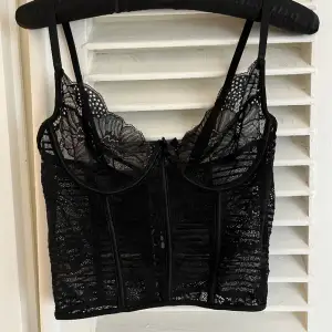 Super cute and sensual lace bustier.  Thrifted in Paris.