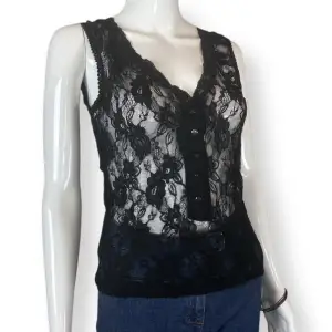 See trough tank top with front buttons. No damages, in good condition. From the brand Vera Moda , labeled as size M.  Measurements laid flat: Shoulder to shoulder 33cm, Waist width 34cm, Pit to pit 39cm Length 54cm