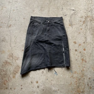 Reworked Skirt - Made from different denim forming a skirt with a slit 