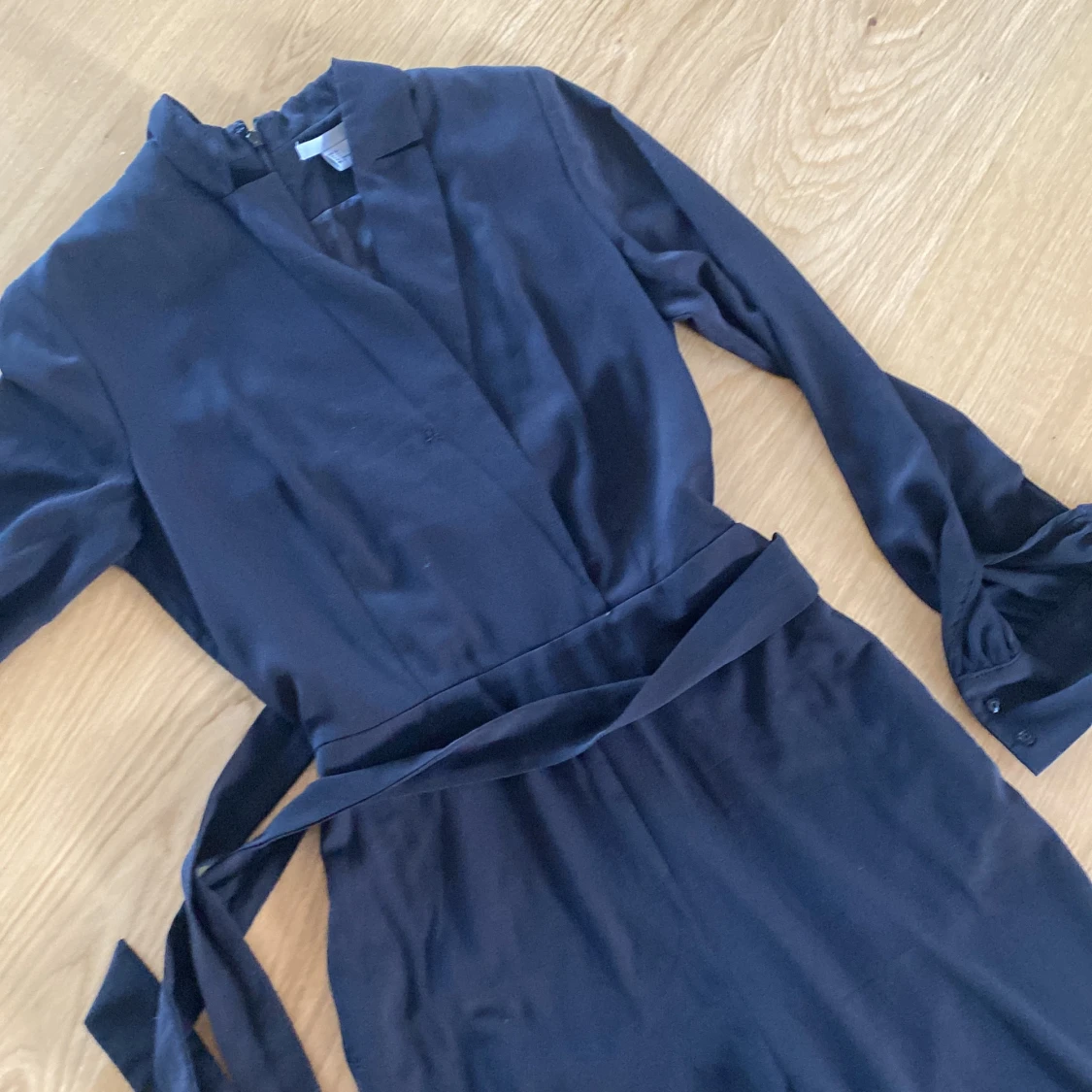 Svart långärmad jumpsuit - 90