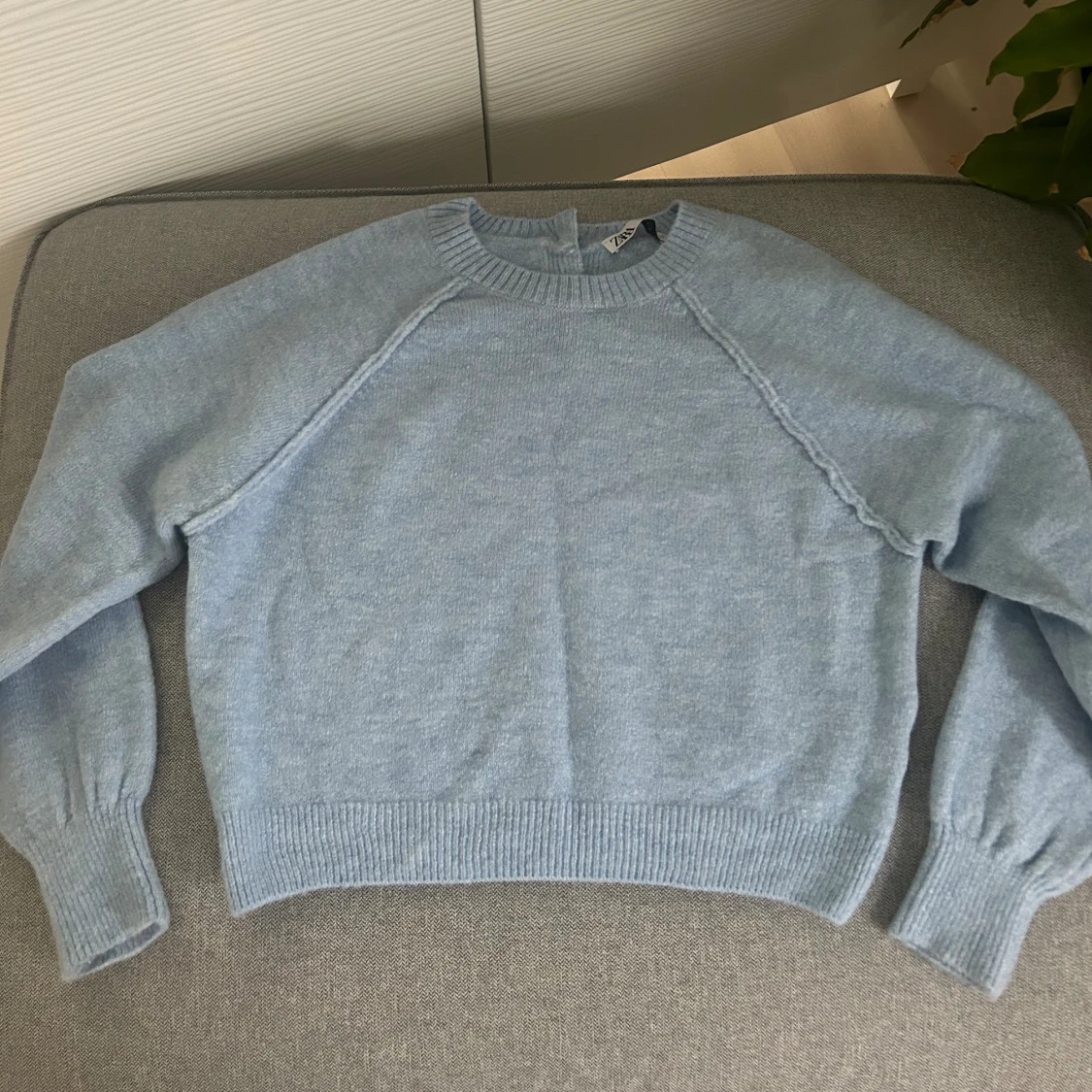 Ljusblå stickad tröja