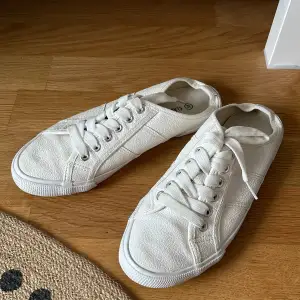 White mule sneakers  Used but in good condition  It has shiny surface 