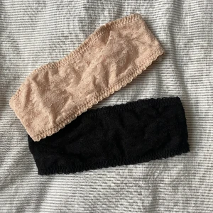 Beige och Svart tub bh  - Två stycken strapless bh-ar i strl xs. Andvända fåtal gånger och säljer då dom blivit för små! De är i fint skick och spetsen skaver inte!