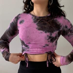 Tie dye psychedelic top, perfect for parties and clubbing! It’s a size XS but stretchy and you can make it longer