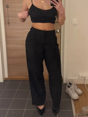 Svarta kostymbyxor - Svarta kostymbyxor i storlek XS från Gina Tricot. Använda en gång