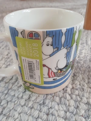 Muminmugg Vi åker på semester Mumin  - Utgången oanvänd felfri mugg, med etikett. Packar mycket bra. 