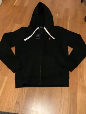 Black hoodie - Very stylish black hoodie that fits anyone. Very good condition on the zipper, logo and rest of the hoodie. Extremely comfortable and suits anyone. 
