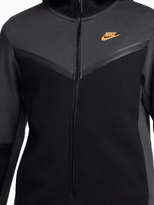 Svart och mörkgrå Nike hoodie - Snygg hoodie från Nike i svart och mörkgrått med dragkedja framtill och orange Nike-logga på bröstet. Hoodien har huva och är tillverkad i ett mjukt material som passar perfekt för en sportig och avslappnad stil.