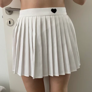 Tennis skirt  - White tennis skirt from shein is size small. Never used just tried it for the pictures 