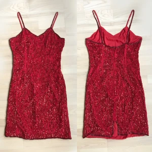 Red Sequin Vintage Party Dress - Secondhand vintage. Bought originally for: 600 sek. Fabric is a bit torn in some areas and some sequins have fallen off but it is not very noticeable. 100% Silk, with Polyester lining. Made in India. 